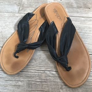 Olukai black leather flip flops